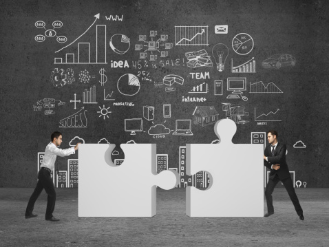 Two_puzzle_pieces_to_create_a_successful_small_business