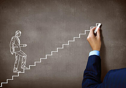 businessman_climbing_stairs_to_build_a_successful_small_business_180923589