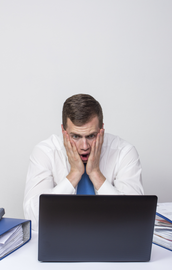 man scared at computer