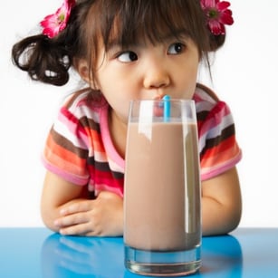 little_girl_drinking_chocolate_milk