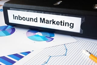 inbound marketing binder on top of reports